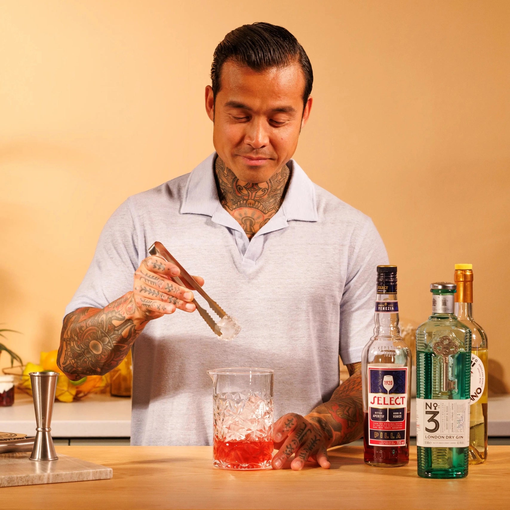 mix and add ice to the Yuzu Negroni cocktail