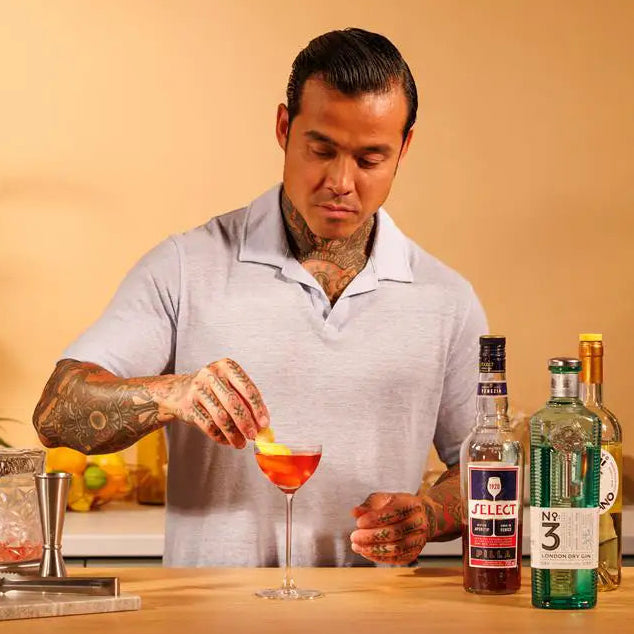 garnish and enjoy the yuzu negroni cocktail